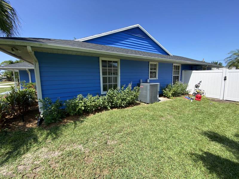 After: new lawn and a planted bed along the same side of the house