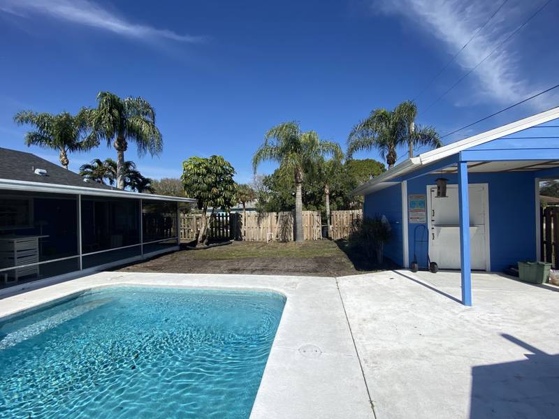 Before: bare ground behind a backyard pool